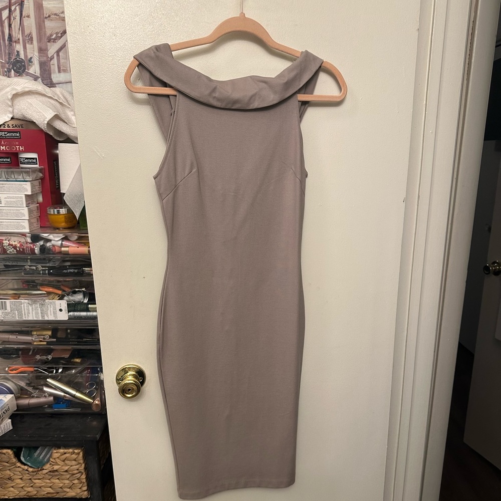 New nude form fitting knee length dress. Size small